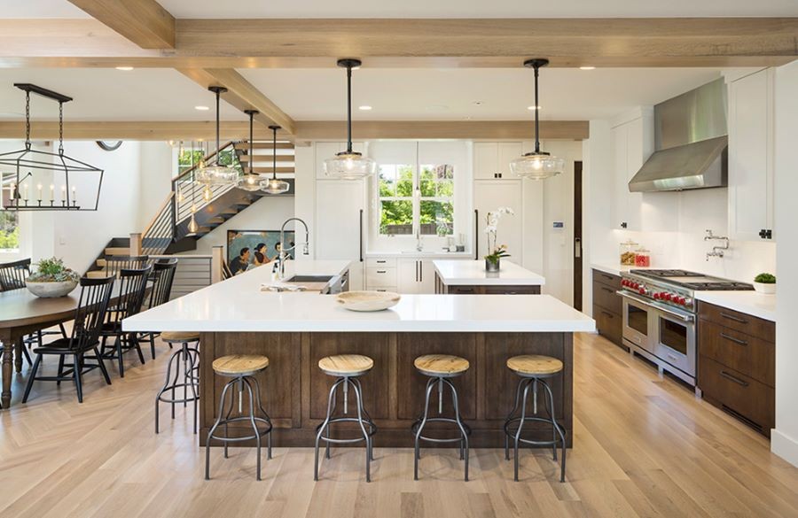A kitchen and dining area with numerous light fixtures.