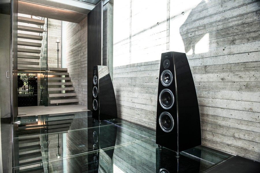 Two black Meridian loudspeakers standing side by side. 